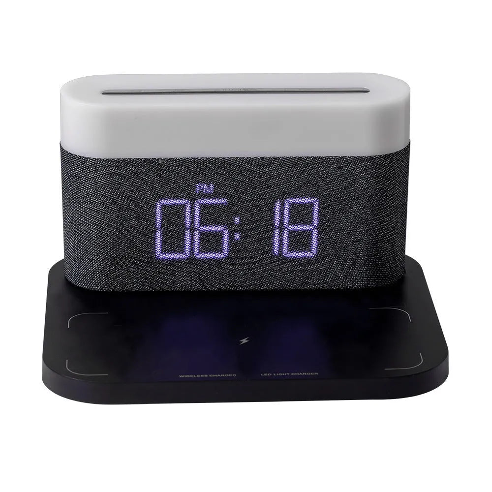 White or black table lamp with integrated wireless phone charger and digital clock display