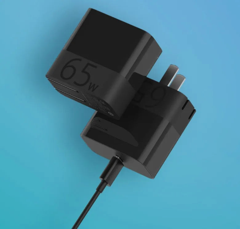 Black ZMI USB-C 65W laptop power adapter with compact design and notebook charging capability