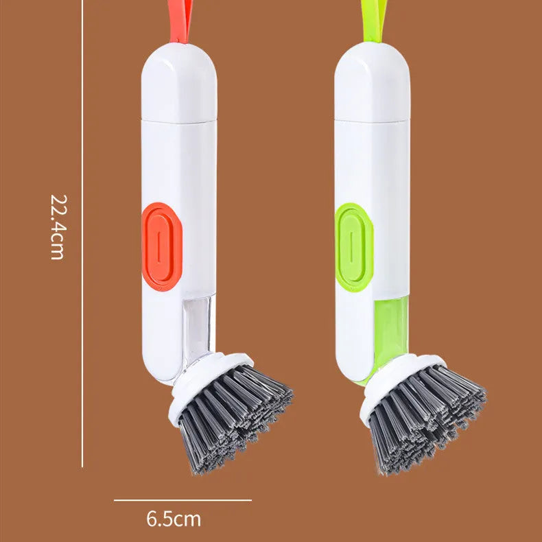 White and red long-handle kitchen brush with liquid dispenser button and two removable brush heads.