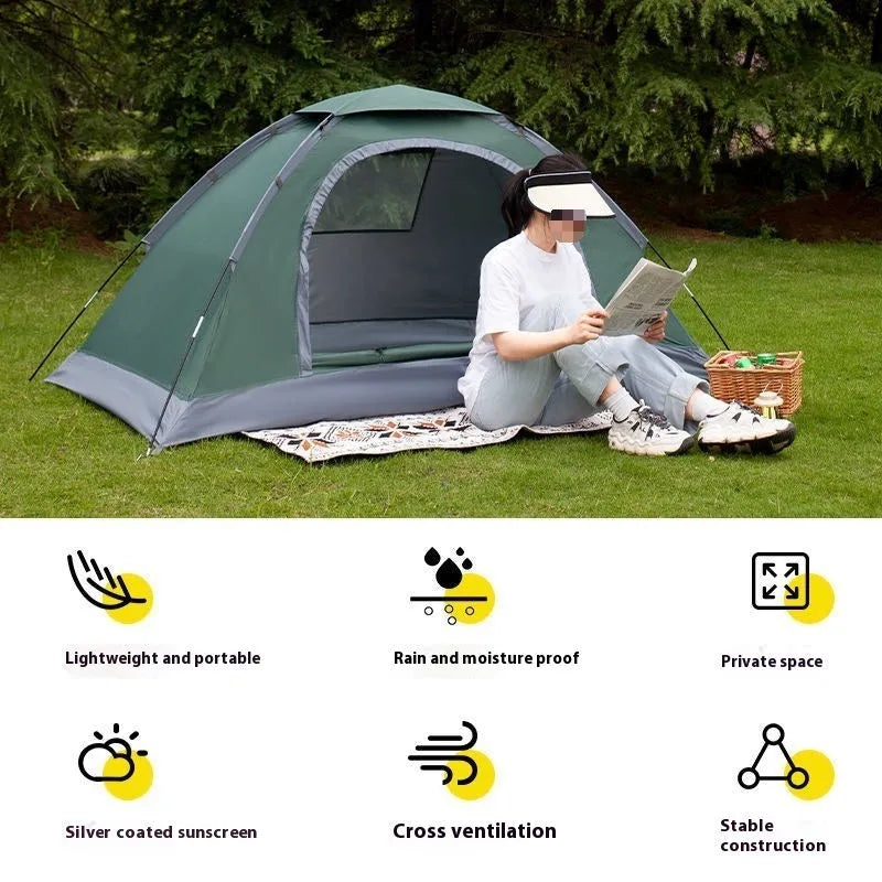 Single-person manual camping tent in army green, set up outdoors with fibre-glass poles.