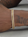 Gold coloured titanium steel tennis bracelet with gemstone inlay for men and women