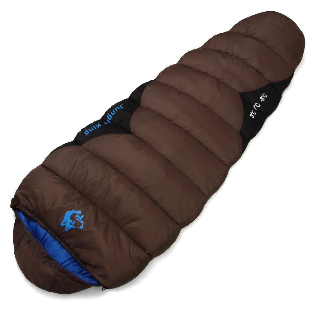 Army green cotton-filled camping sleeping bag with compression storage sack.