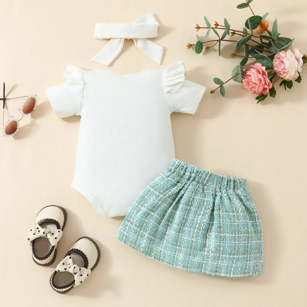 Babies' short-sleeved blouse skirt suit in black with plaid pattern, including romper, skirt and hairband
