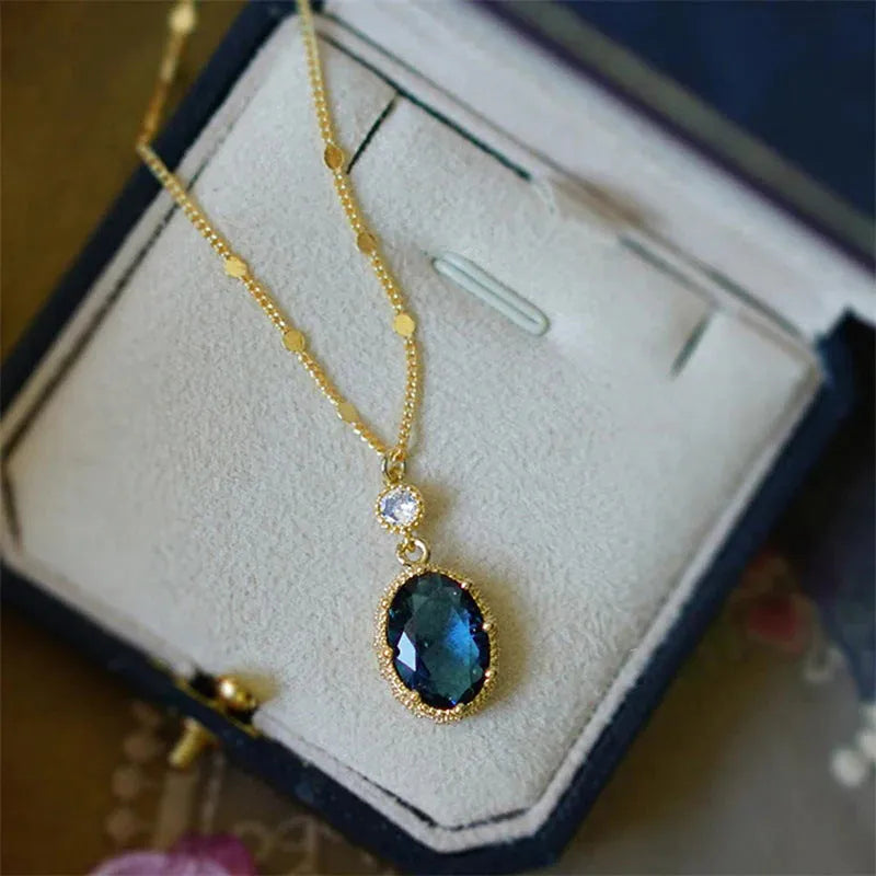 Gold colour geometric pendant on a chain, French retro necklace design