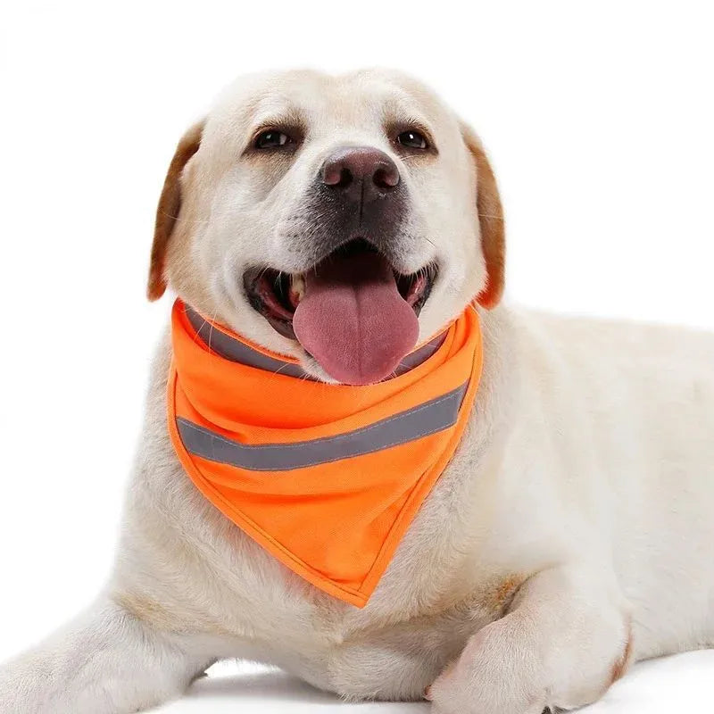 Yellow and orange reflective dog bandana scarf with adhesive fastening strap laid flat.