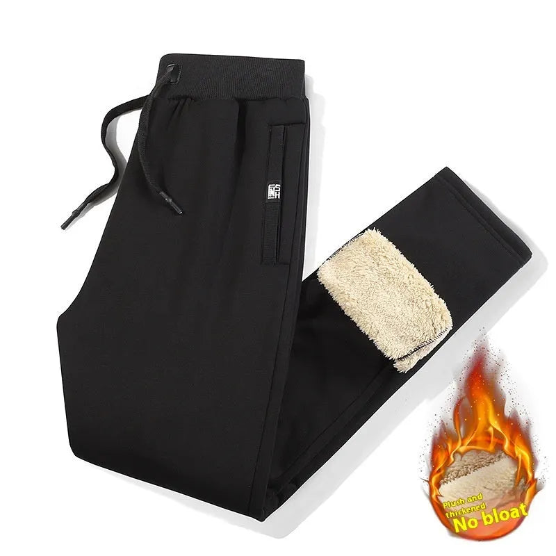 Men's grey fleece-lined oversized cotton track pants with elasticated waistband on a hanger.