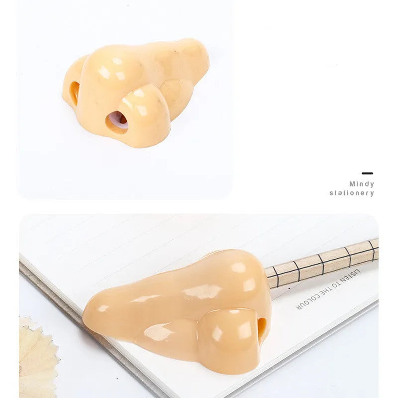 Flesh colour plastic manual pencil sharpener with big nostril and geometry shape.