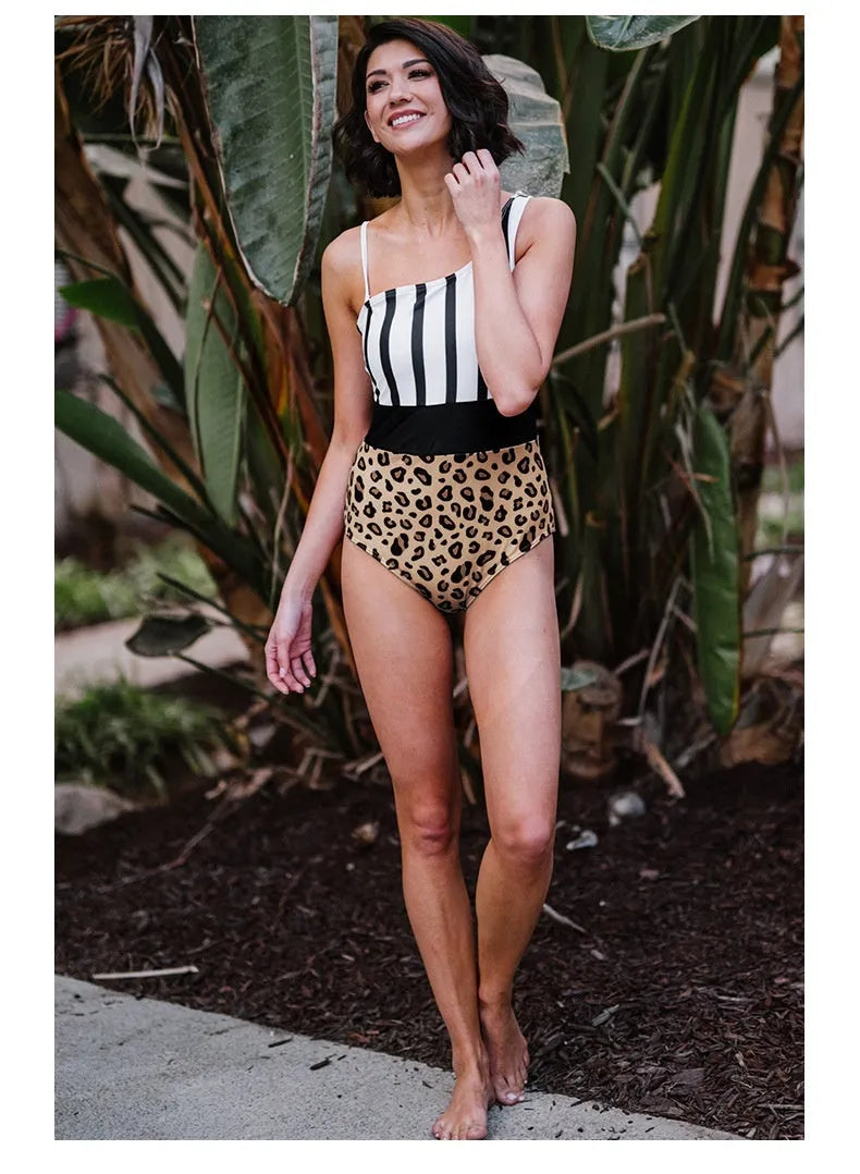 Leopard print women's one-piece swimsuit with asymmetrical collar and high-waist briefs.