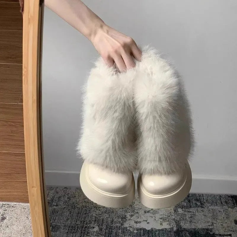 Women's black artificial plush low-top snow boots with a round toe and waterproof rubber sole.
