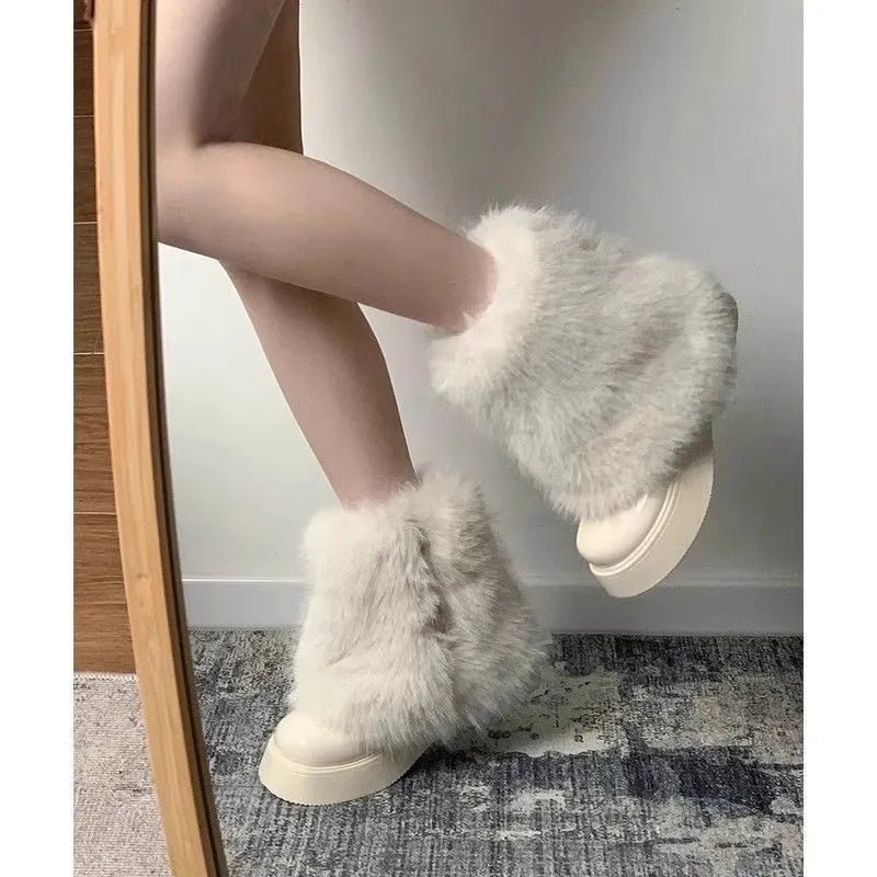 Women's black artificial plush low-top snow boots with a round toe and waterproof rubber sole.