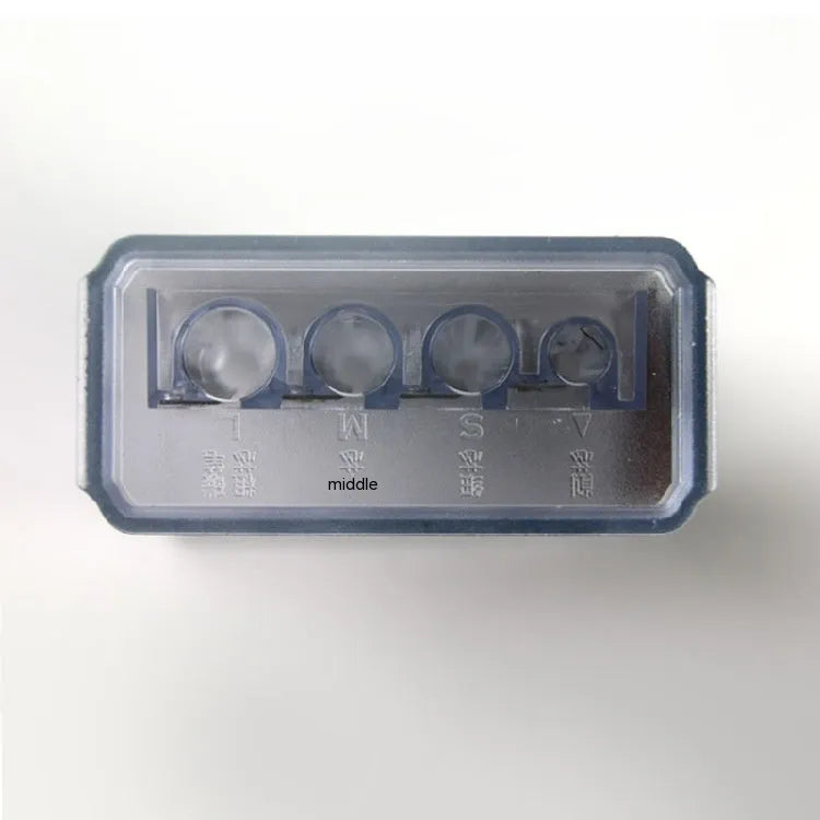 Geometric four-hole plastic pencil sharpener with spare blades and a screwdriver on a white background