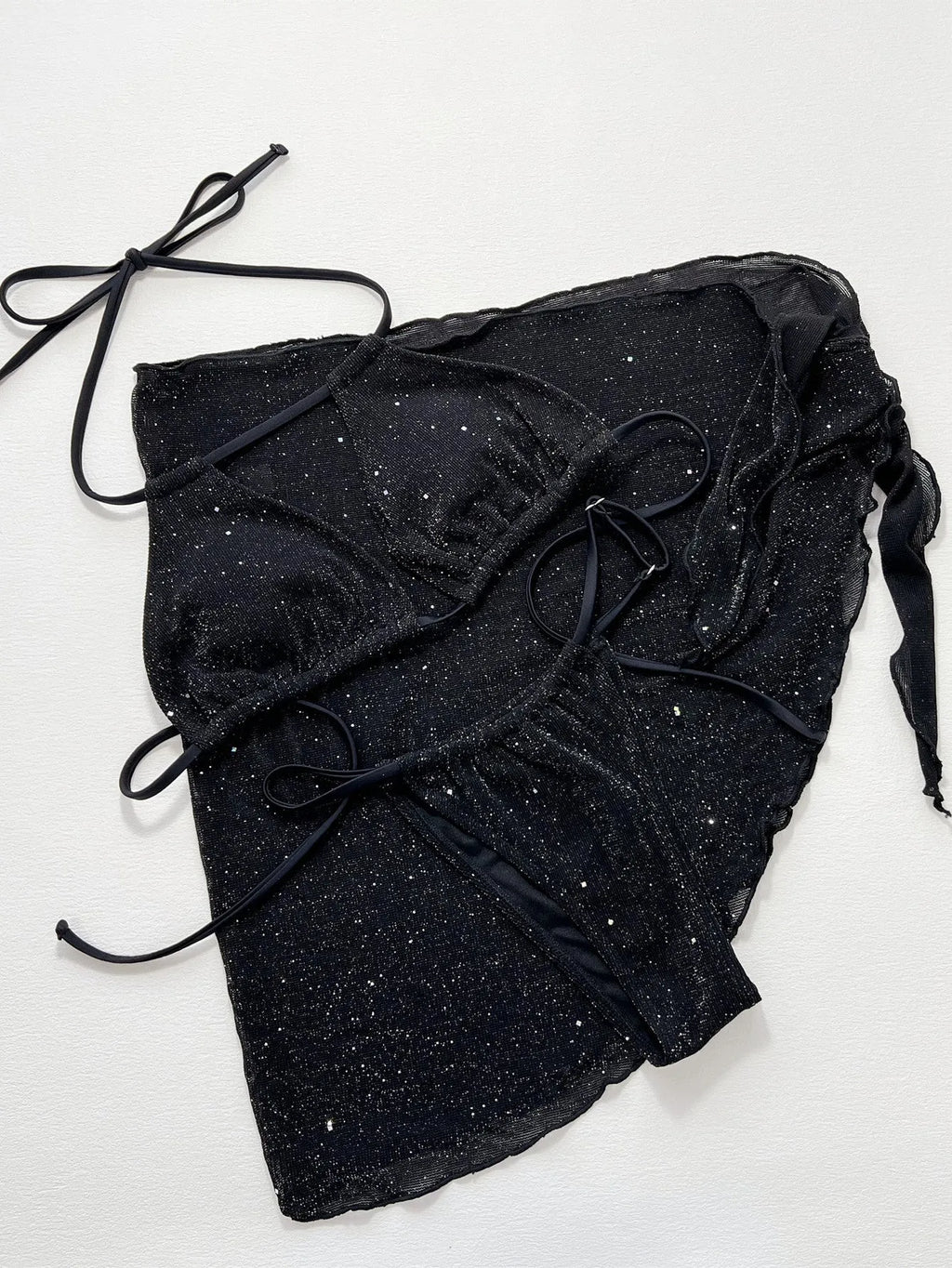 Black women's three-piece bikini swimsuit set with top and shorts on a mannequin.