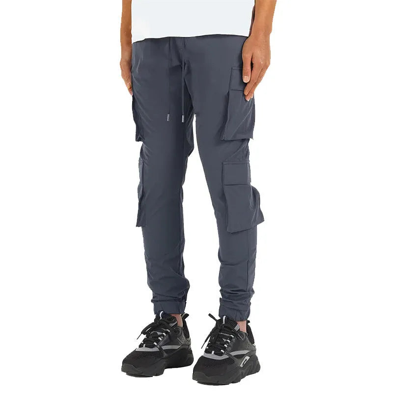 Men's stretch nylon ankle banded slacks in black, side view, plain colour design