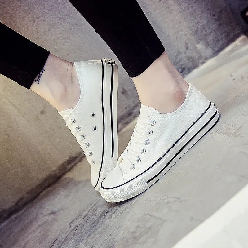 Women's solid colour casual canvas shoes in a lace-up style on a white background.