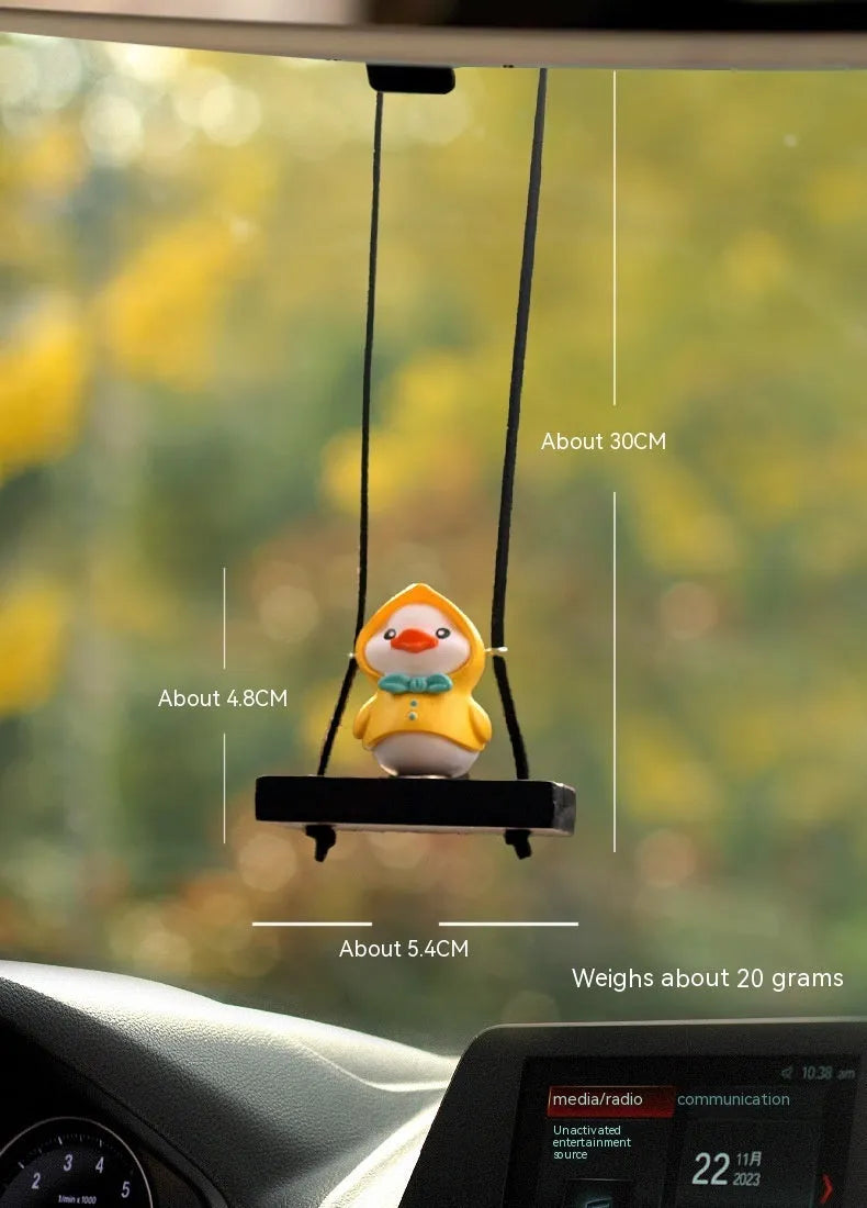 Yellow plastic cartoon duck doll car hanging ornament with a choice of bath towel, swimming ring, bath bucket, or bow pendant.