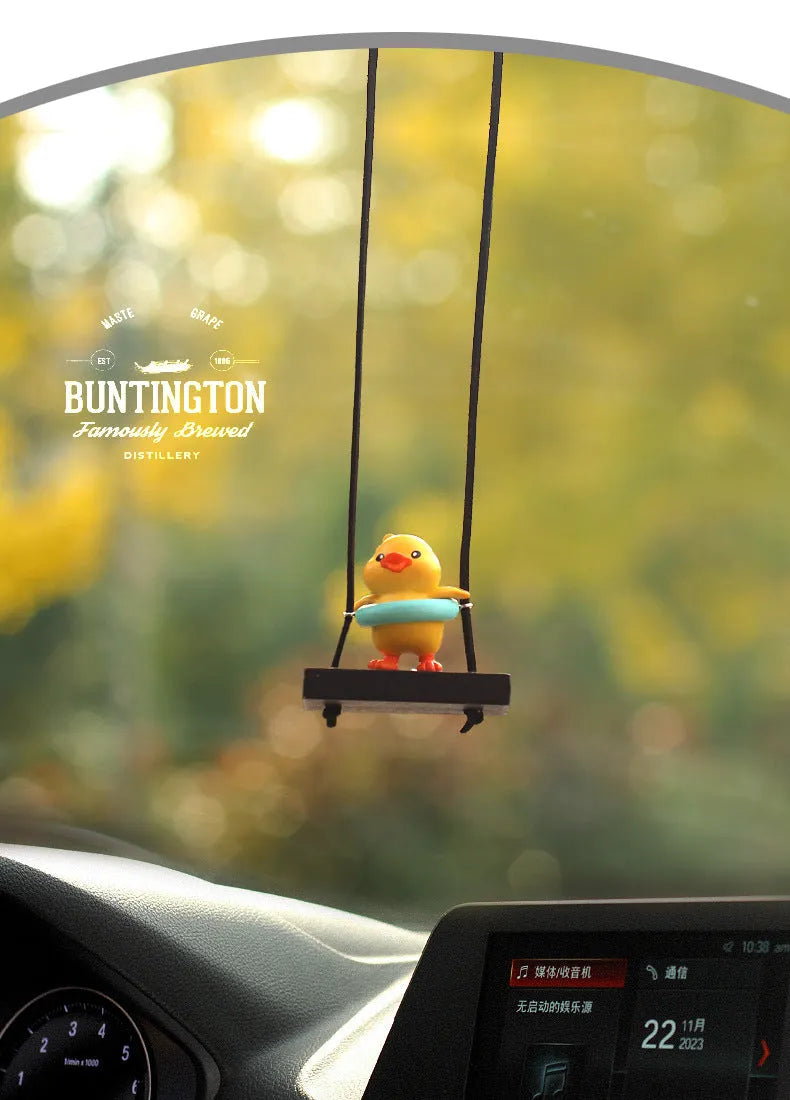 Yellow plastic cartoon duck doll car hanging ornament with a choice of bath towel, swimming ring, bath bucket, or bow pendant.