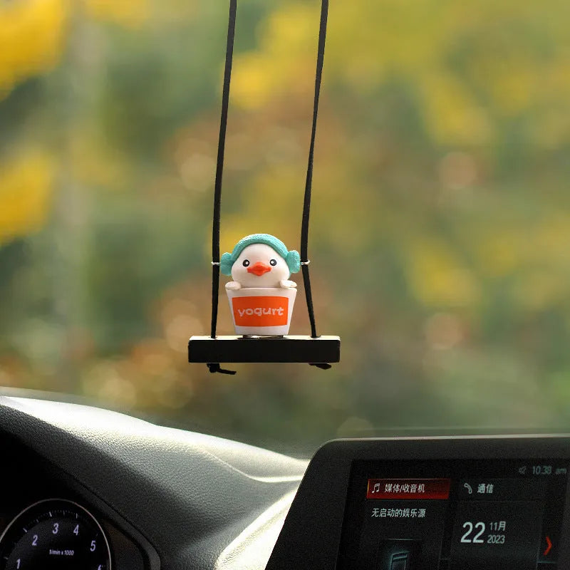 Yellow plastic cartoon duck doll car hanging ornament with a choice of bath towel, swimming ring, bath bucket, or bow pendant.