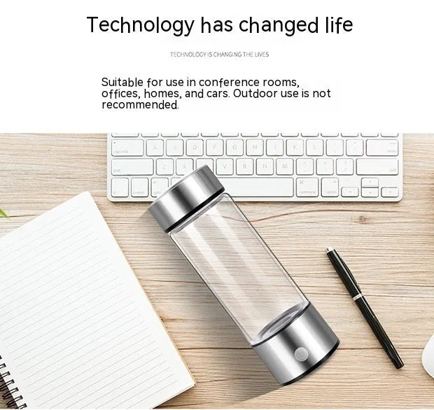 Silver hydrogen water bottle with electric generator, borosilicate glass cylinder.