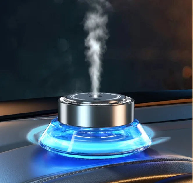 Refillable smart spray car air freshener diffuser in black or green with separate 50ml fragrance bottles.