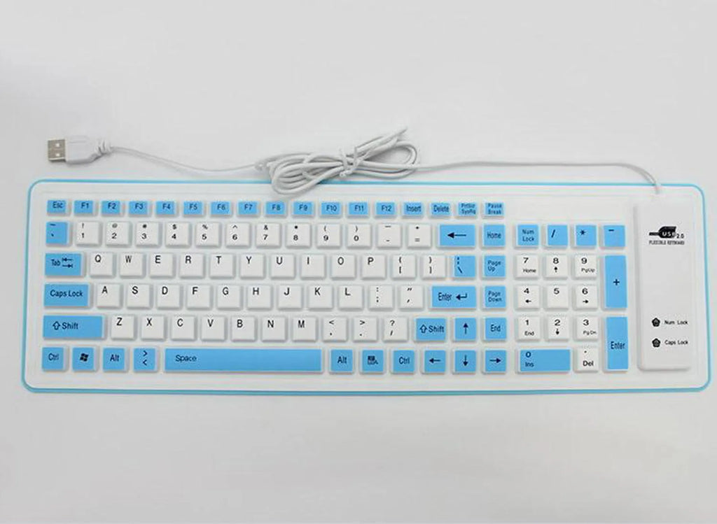 Folding waterproof silicone keyboard in pink with USB cable on a desk