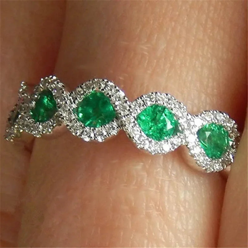 Micro-set ruby and green zircon ring in alloy, shown in green and gules with US size 5 to 12 chart
