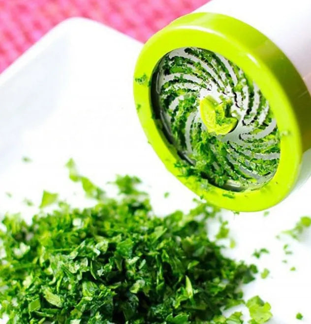 PP plastic and stainless steel herb grinder mill with removable top on a kitchen counter