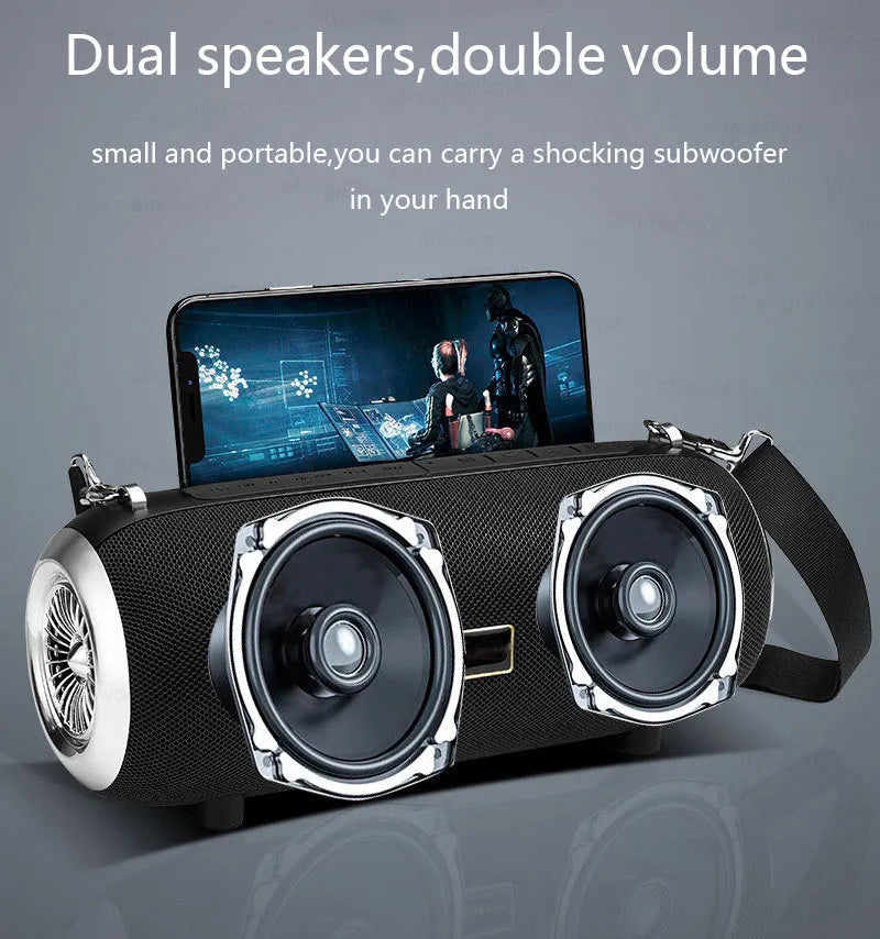 F666 square portable Bluetooth speaker with fabric mesh front, shoulder strap, and mobile phone on stand