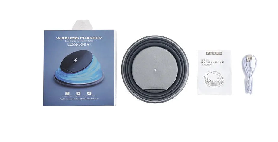Grey wireless charging pad on a desk, 138x138x30mm, with silicone top surface and LED indicator