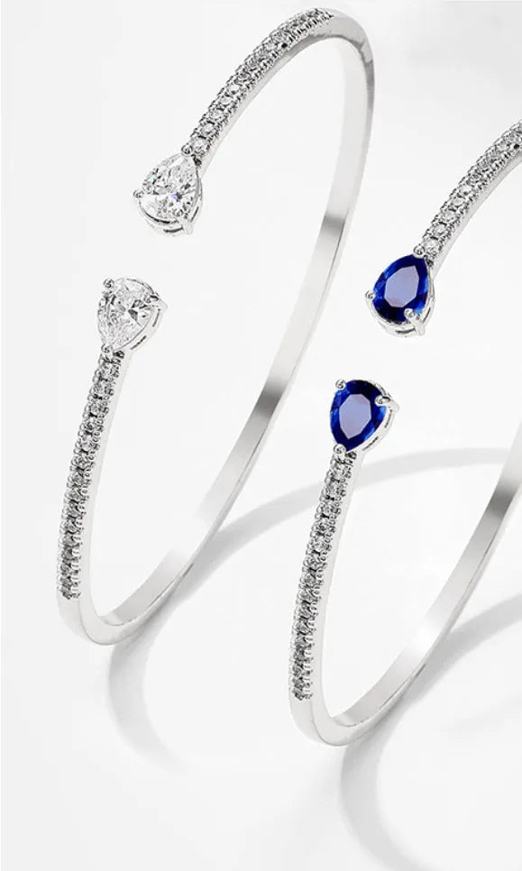 Multi-zircon bracelet with inlaid design on copper material in white or blue colour