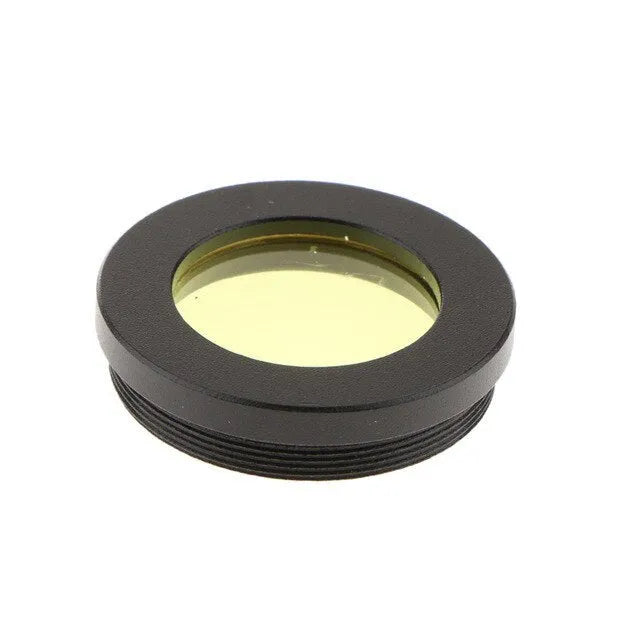 Set of six telescope eyepiece colour filters: green, blue, red, yellow, purple, black on white background