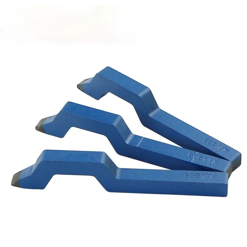 Curved character alphanumeric steel stamping tool for jewellery on a workbench.