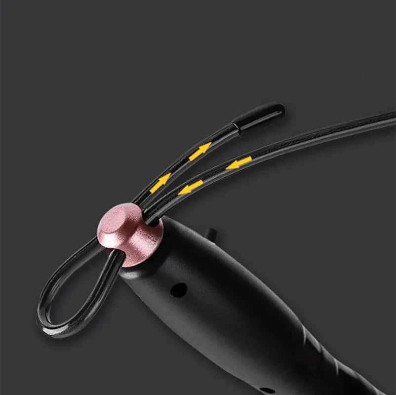 Adjustable digital skipping rope with ABS handles and TPU coated steel cable in black and pink for fitness exercise.