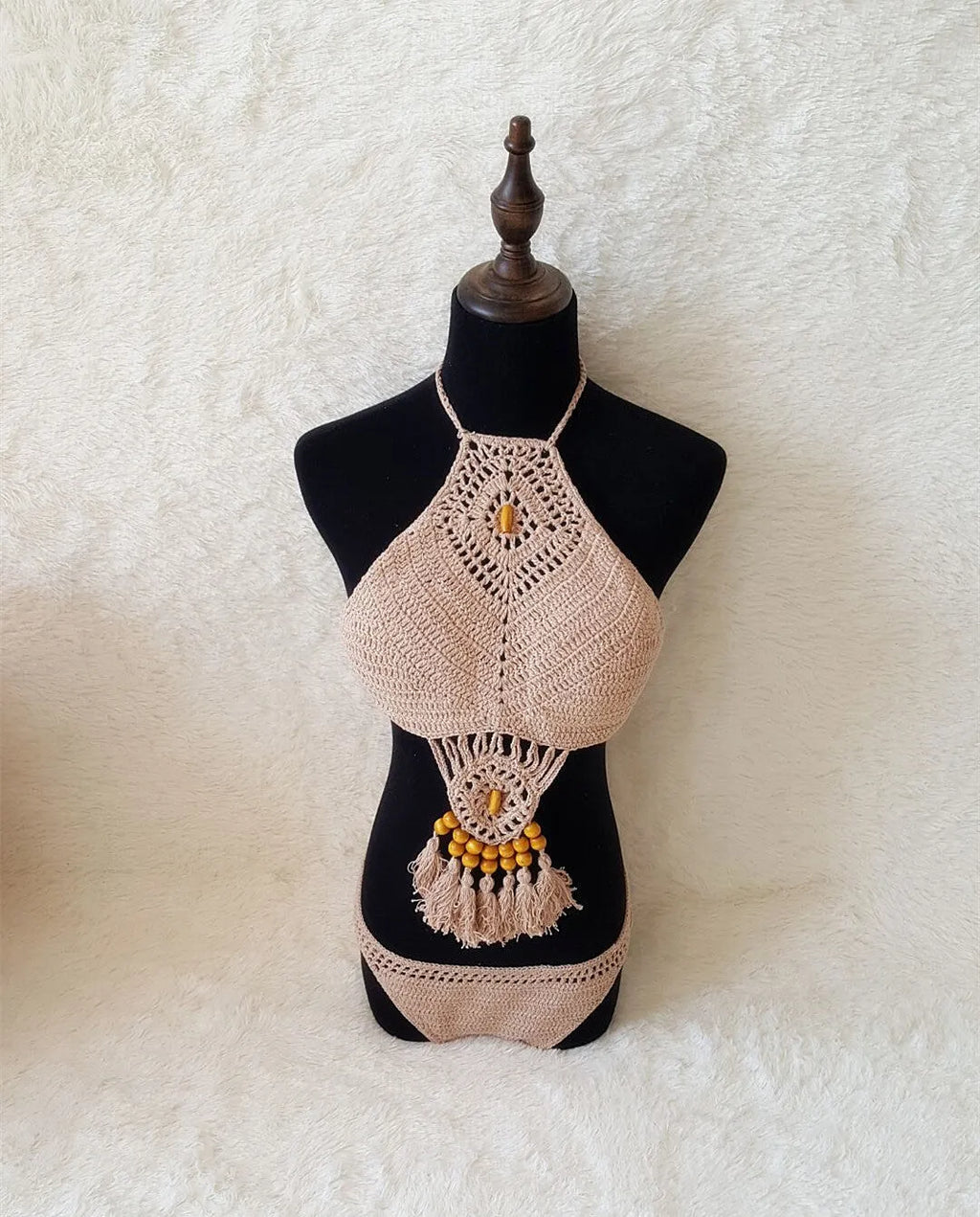 Crochet tassel bikini set for women in black, showing textured weave and tassel trim, beach style