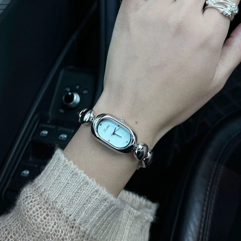 Oval women's watch with 9mm case thickness shown in multiple colour finishes
