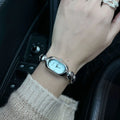 Oval women's watch with 9mm case thickness shown in multiple colour finishes