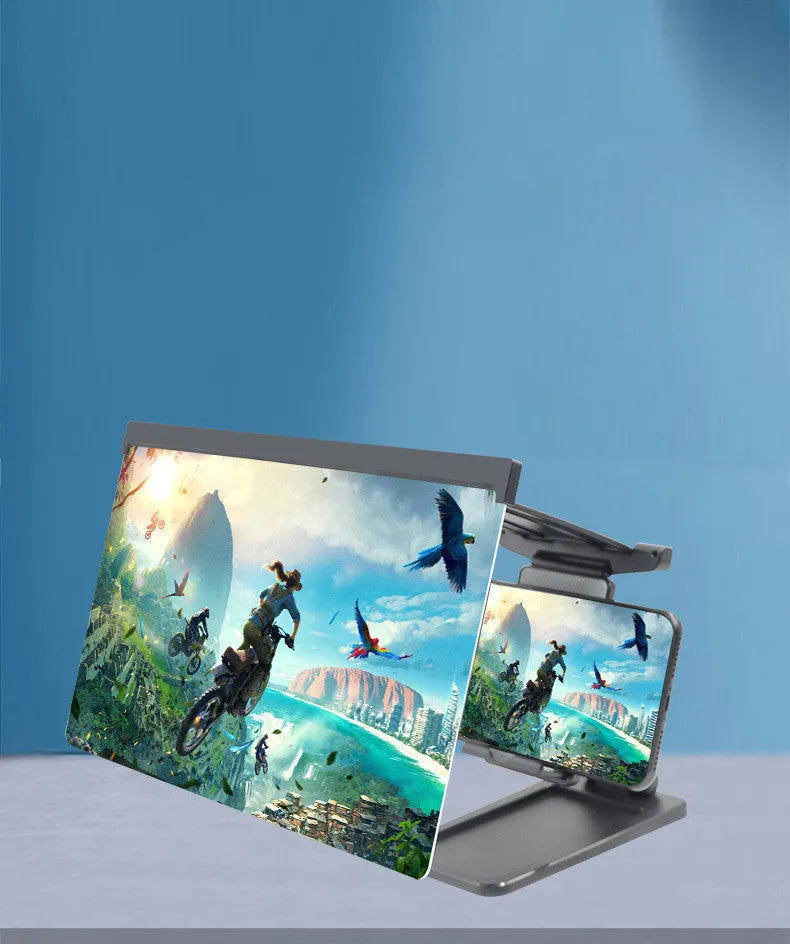 Black foldable mobile phone screen amplifier with a detachable phone holder on a desktop.