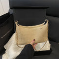 Woven straw shoulder tote bag in khaki colour with sandwich pocket design and internal phone compartment