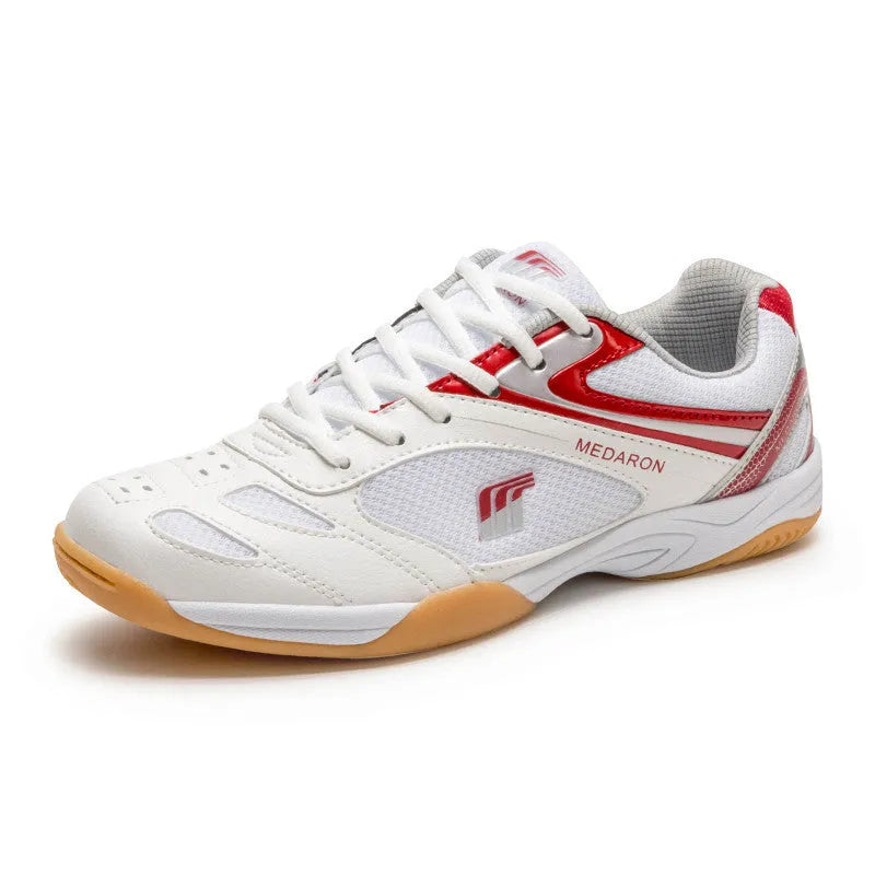 Mesh table tennis sneaker in white and red colour with lace-up front and rubber sole.