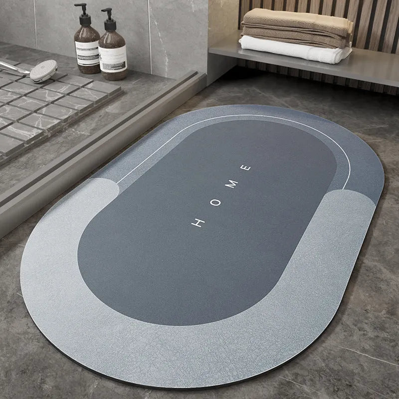 Bathroom floor mat in blue oval shape placed near a sliding shower door.