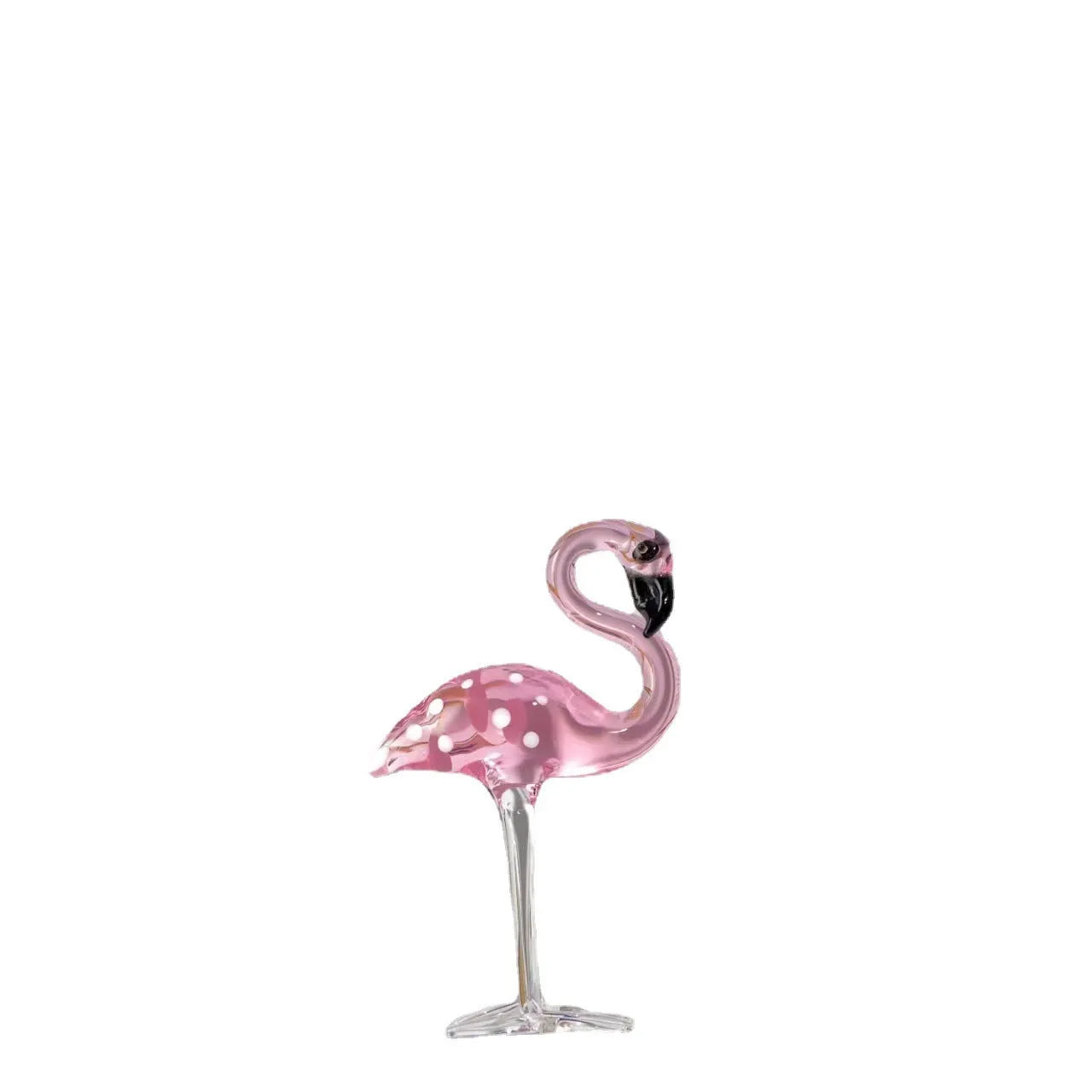 Pink crystal simulation flamingo decorative ornament on a table for home decor or gifting.