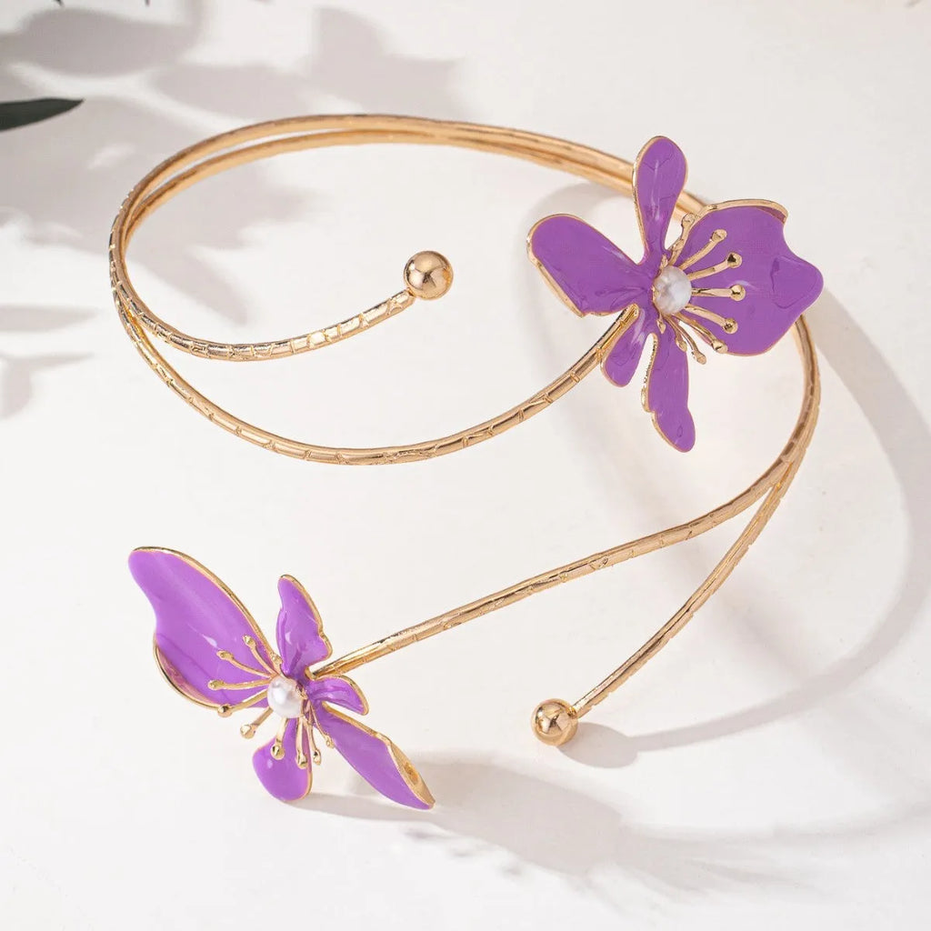 Pink alloy armband with hollow line pattern, shown as an open cuff bangle.