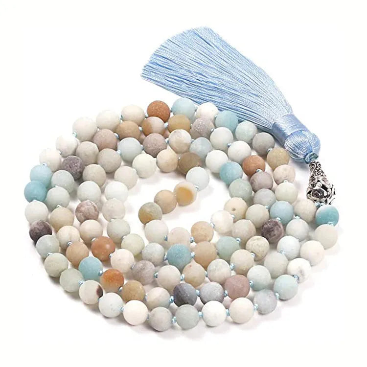 Long geometric agate and gemstone tassel necklace showing colourful beads including amethyst and lapis lazuli.