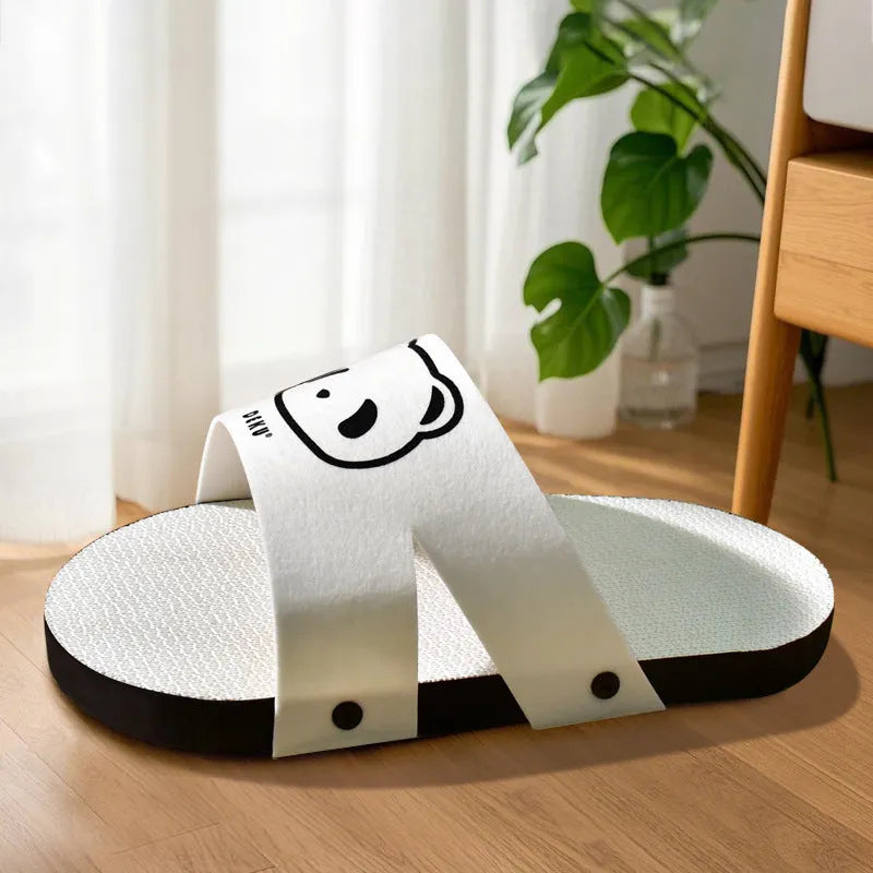 White slipper-shaped corrugated cardboard cat scratch board.