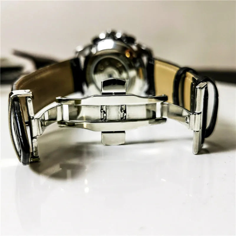 Men's automatic mechanical watch with a 12mm steel case on wrist, showing black dial and black case option.