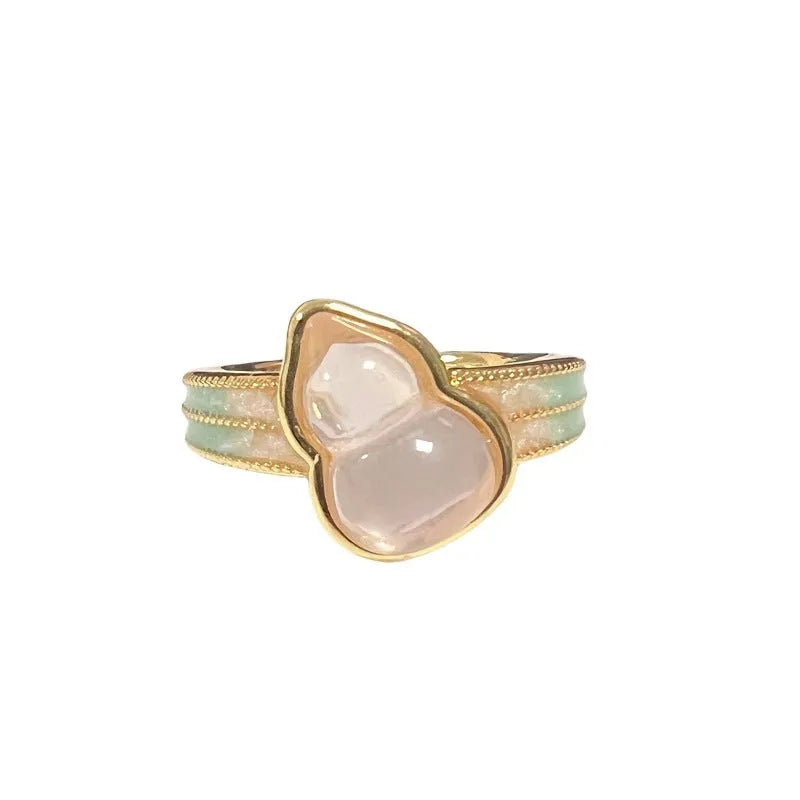 Adjustable vintage-style copper ring with inlaid zircon stones, featuring gourd, flower, and bow shapes.