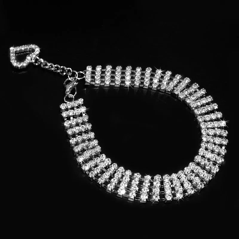 Four-row rhinestone pet collar with heart-shaped chain, silver plated, shown in white, pink, or blue