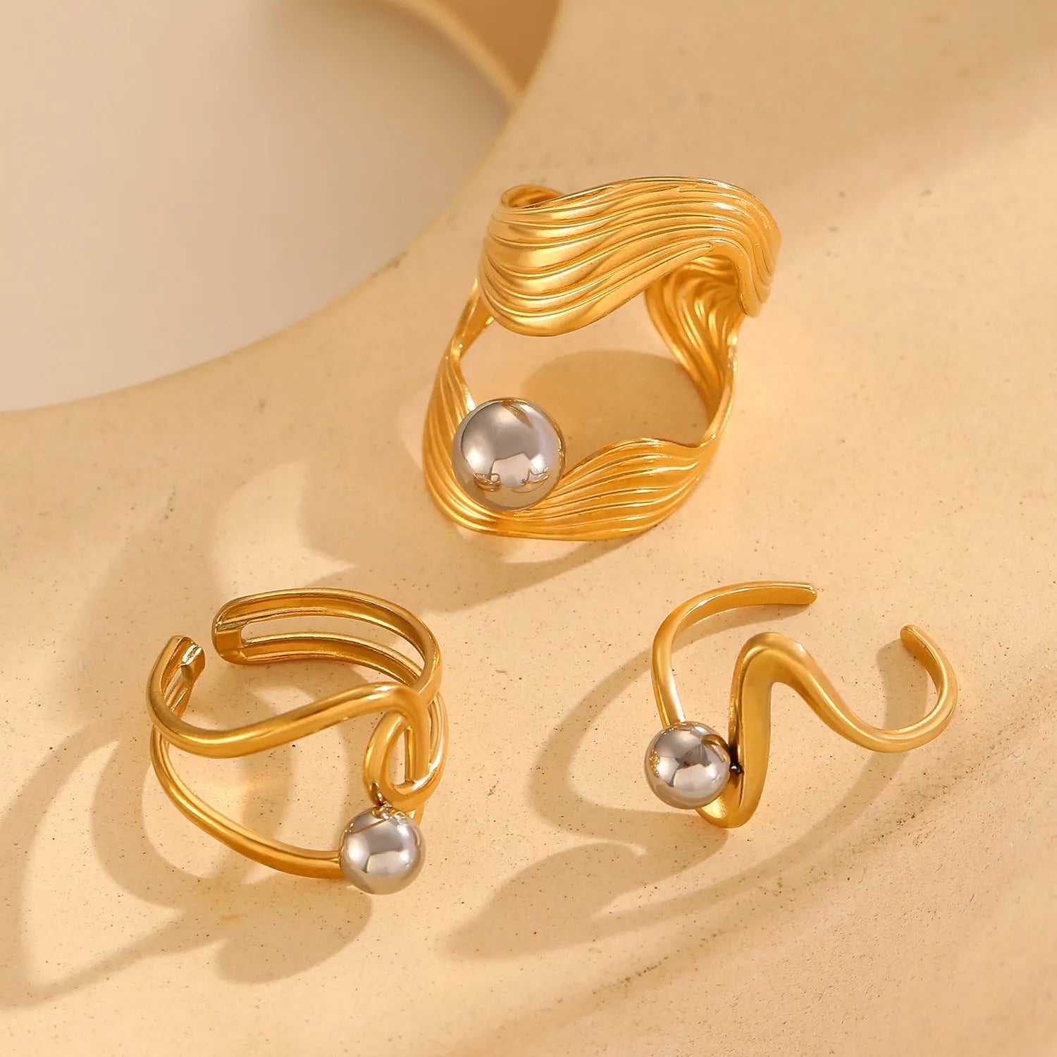 Stainless steel geometric open ring with 18K real gold finish and hollow line detail