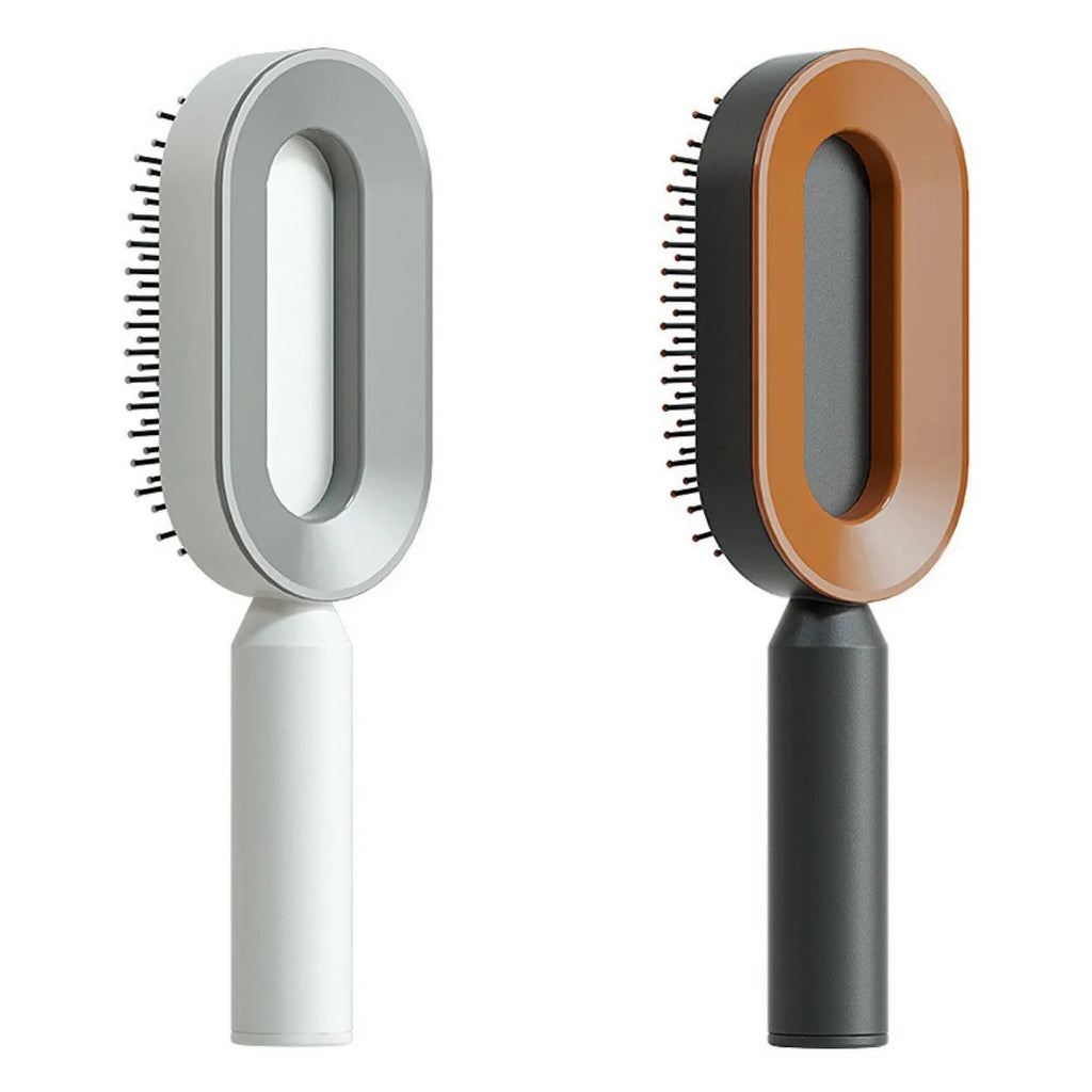 Self-cleaning air cushion hair brush in white, black gold, or black purple with ergonomic handle