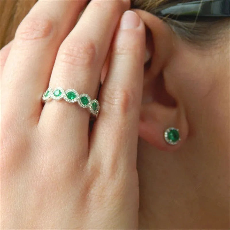 Micro-set ruby and green zircon ring in alloy, shown in green and gules with US size 5 to 12 chart