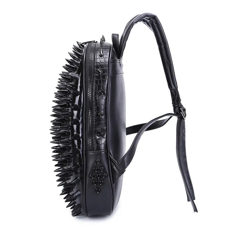 Women's oval black punk rock style travel backpack with hollow-out details and air cushion straps.